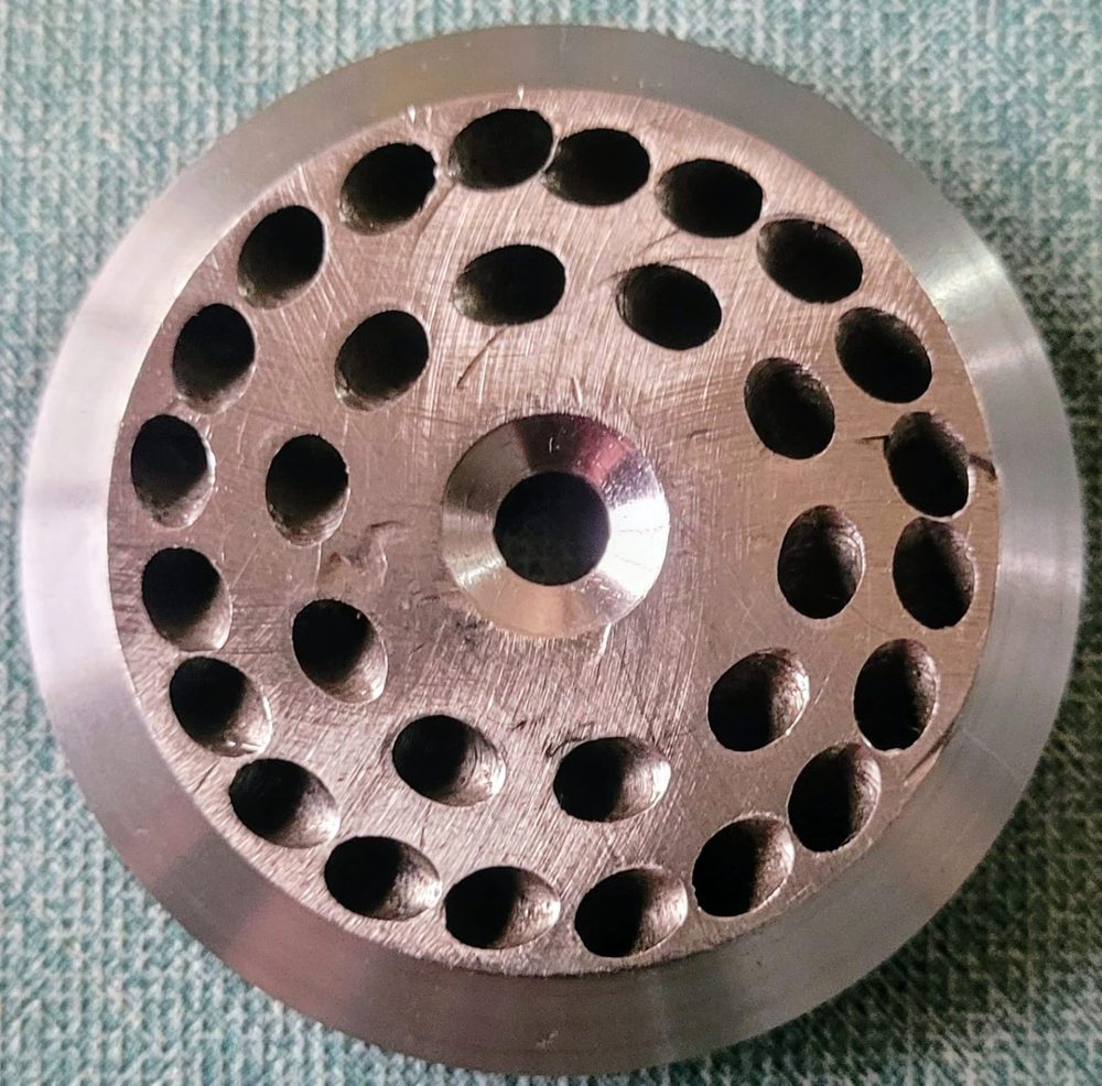 Perforated bronze die plate
