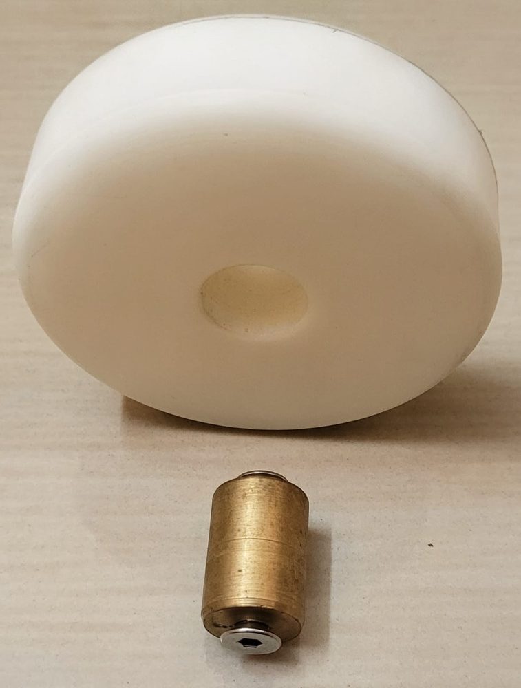 White nylon barrel roller with a brass bush