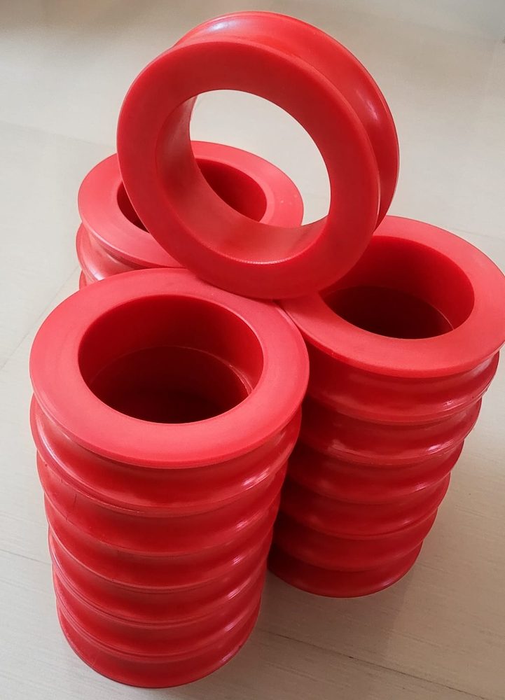 Red polyurethane rollers and ribbed bushes made by SEW