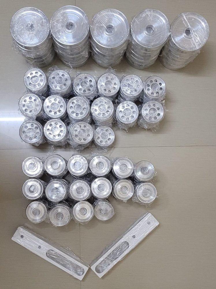 A production batch of machined aluminium spools